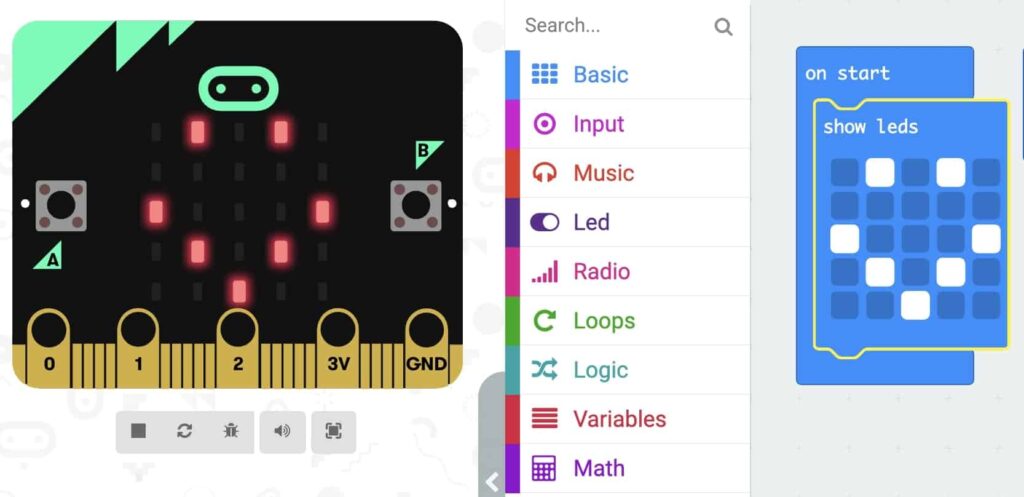 Micro:Bit with LEDs lit up in the shape of a smile face beside the image of the code ‘On start’ Loop with ‘Show LEDs’ block inside. The ‘Show LEDs’ block has LED squares clicked on in the shape of a smile face