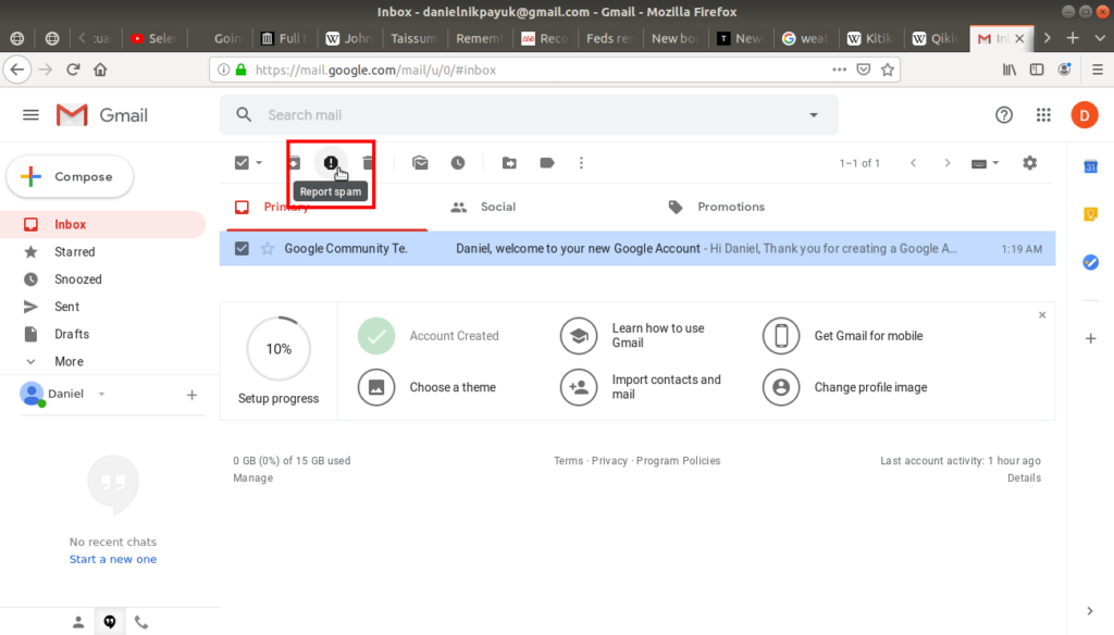 Report spam highlighted in gmail's tool bar.