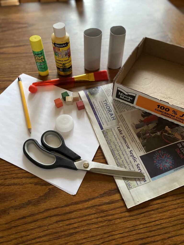 Recycled marble maze activity materials.