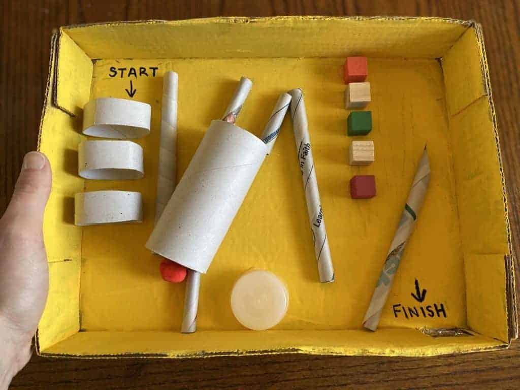 Various materials laid out in a yellow box.